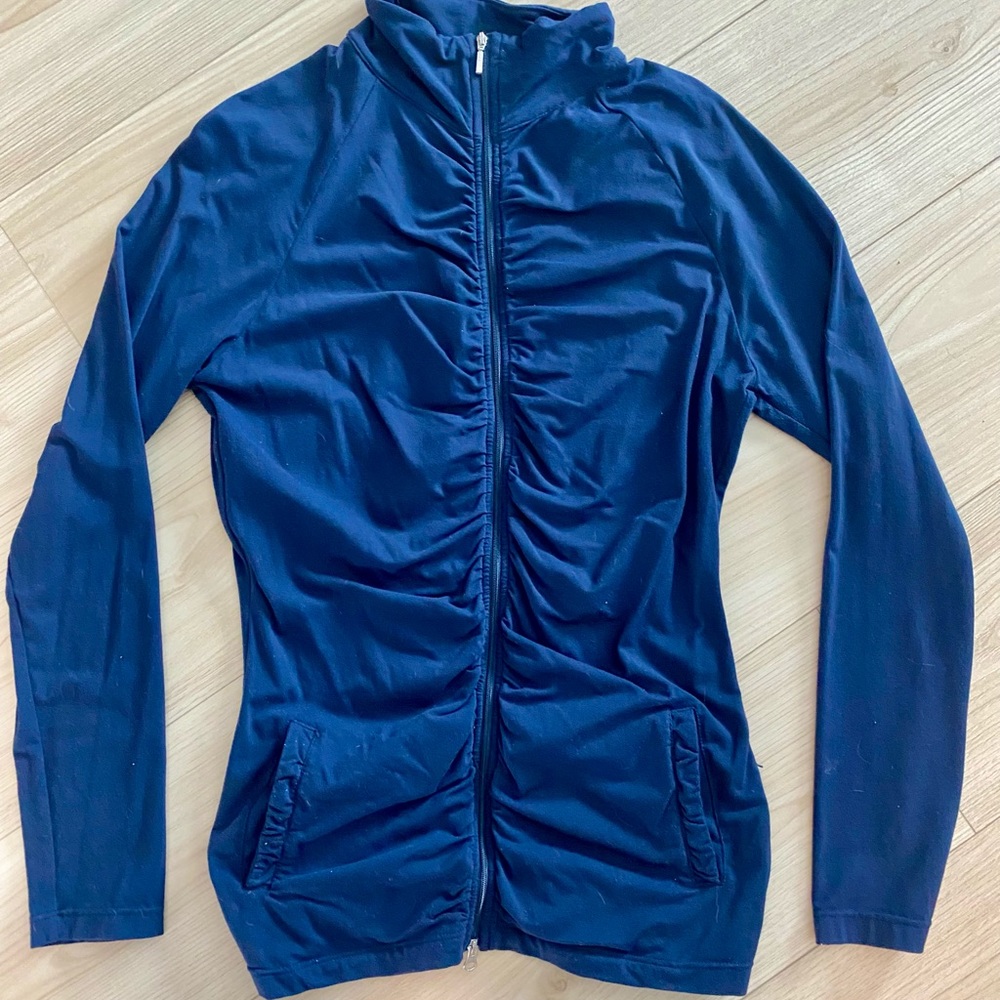 Women’s Lucy size M zip sports top. Navy blue Ruffled front. Soft and stretchy